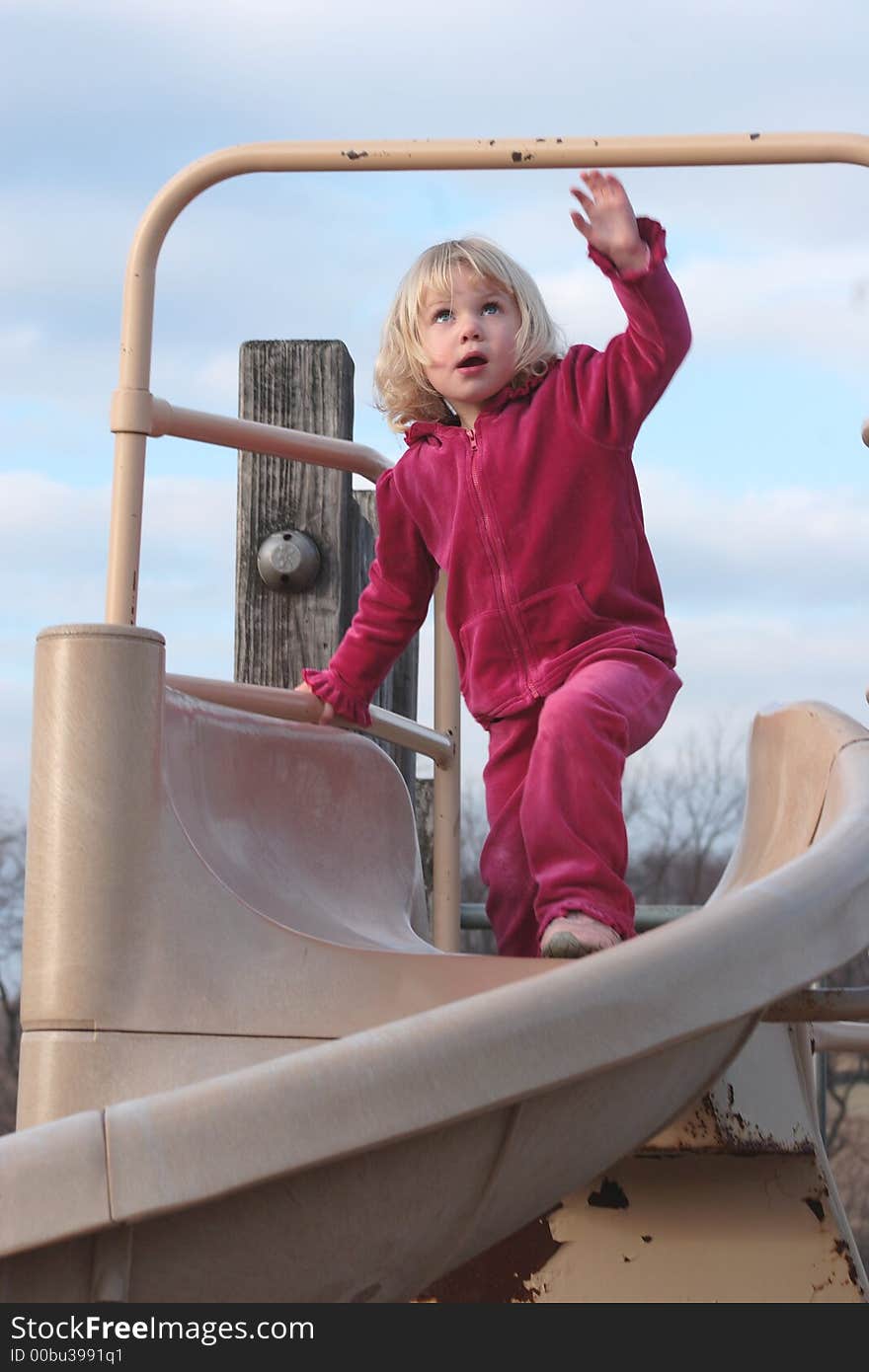 Toddler Playing on Slide