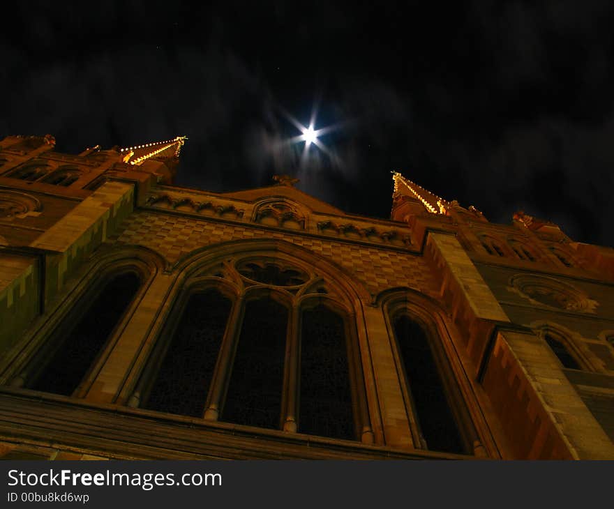 St Paul's Cathedral, Melbourne Australia, located on Swanston Street and Flinders Street, in the CBD. This photo is at night with the moon shining through clouds. This is a historic building in Melbourne, and was built in 1882. St Paul's Cathedral, Melbourne Australia, located on Swanston Street and Flinders Street, in the CBD. This photo is at night with the moon shining through clouds. This is a historic building in Melbourne, and was built in 1882.