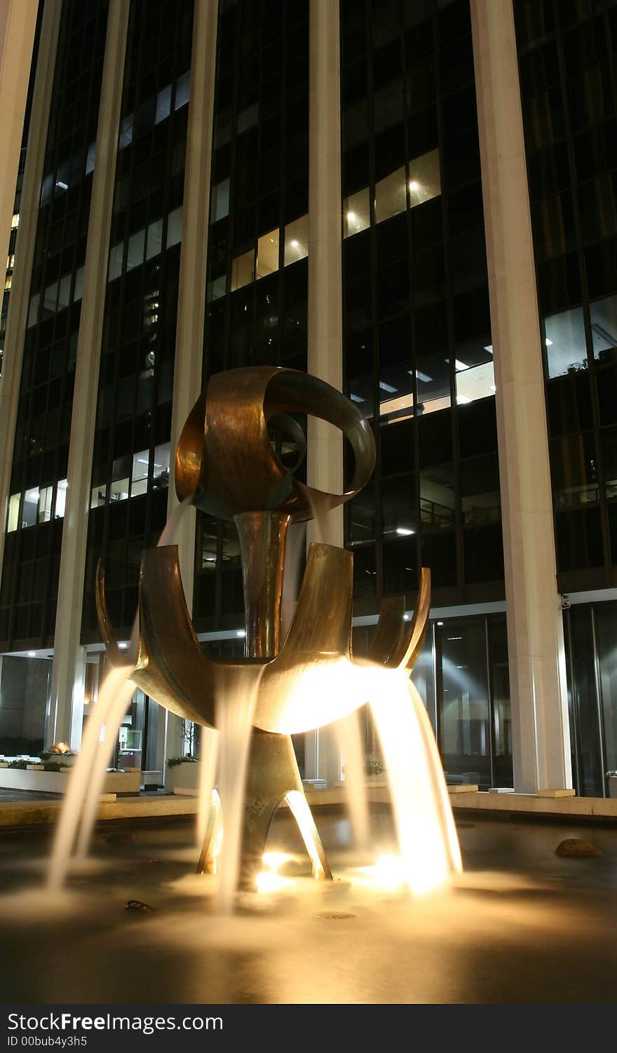 Long exposure capture of a fountain in front of an office tower. Long exposure capture of a fountain in front of an office tower.