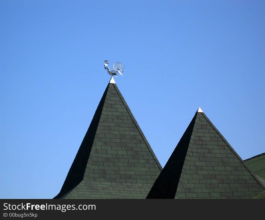 Windvane the cock a roof a tile the sky a life air