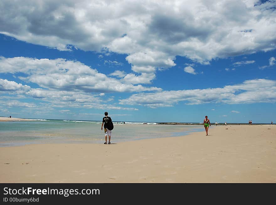 Sand, sea, clouds and some people. Sand, sea, clouds and some people