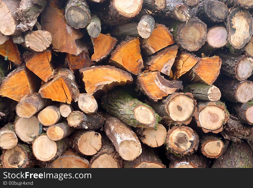 Photo of stacks of cut wood. Photo of stacks of cut wood