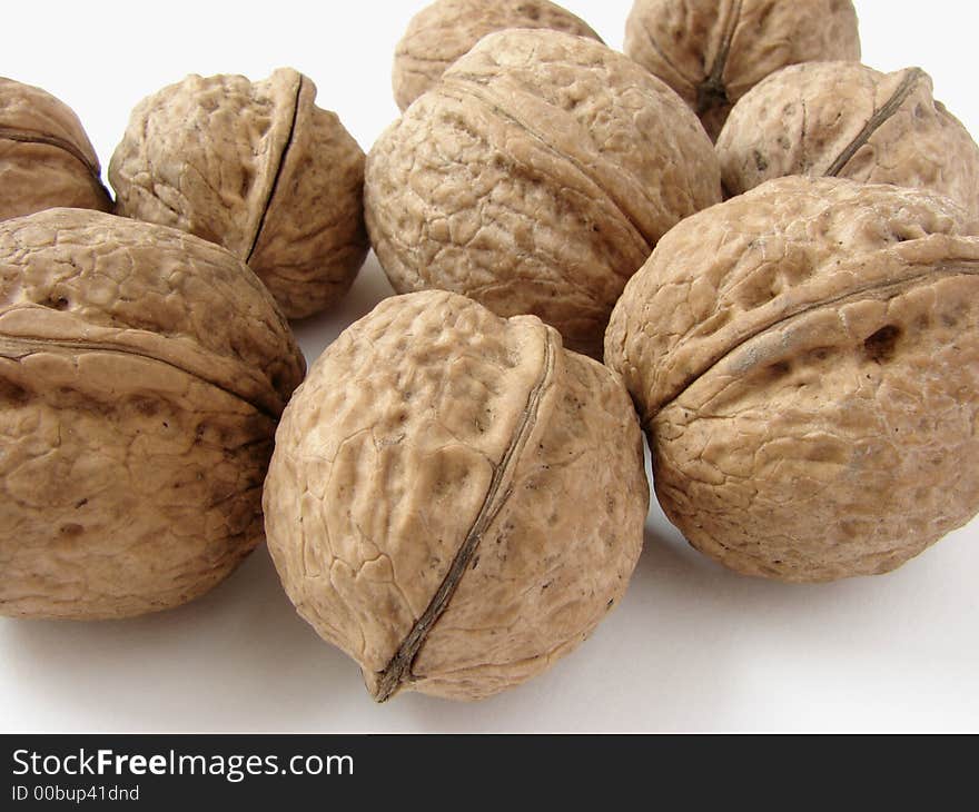 Some walnuts on the light background