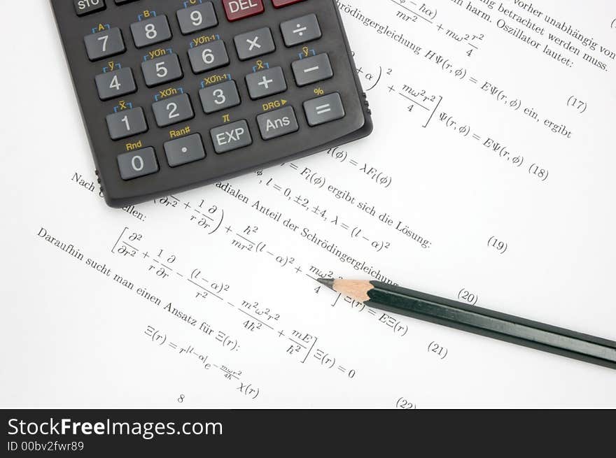 Still life of an calculator and a pencil on scientific paper. Still life of an calculator and a pencil on scientific paper