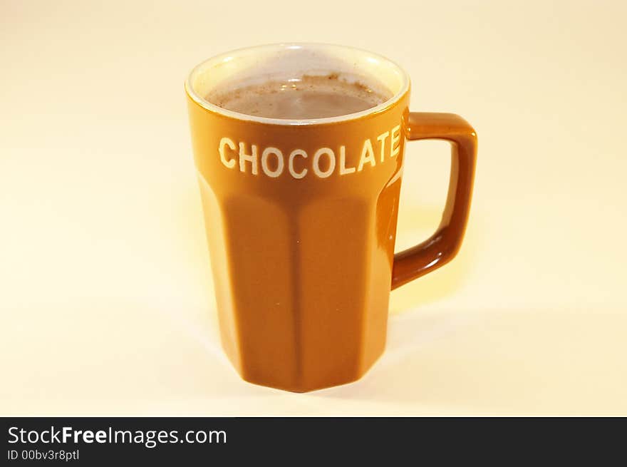 Cup hot chocolate milk with light background