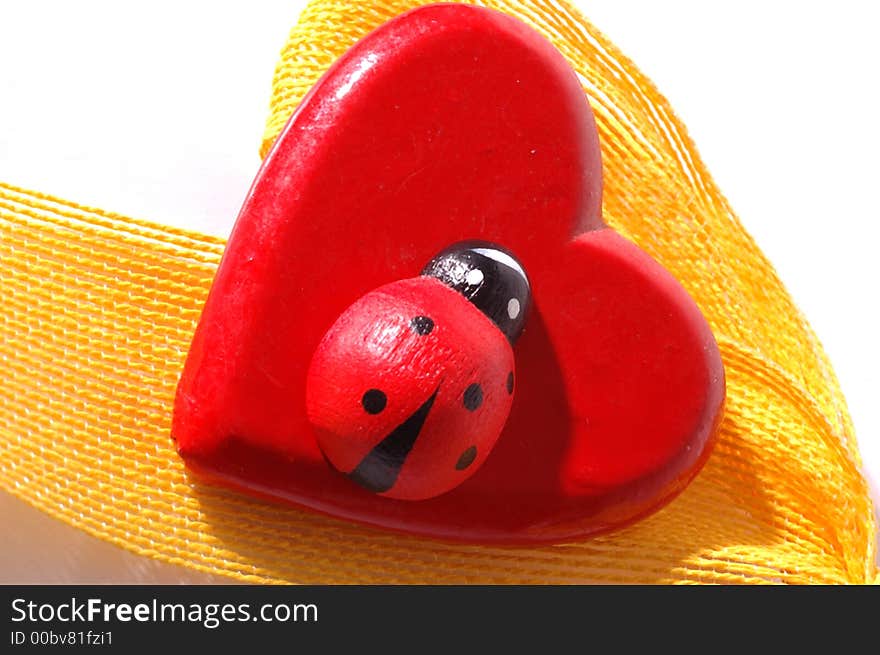 Red heart with yellow ribbon and ladybug. Red heart with yellow ribbon and ladybug