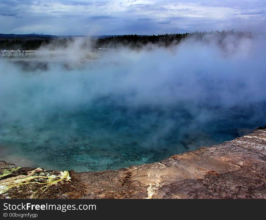 Hot Geyser in yellow stone on a summer day