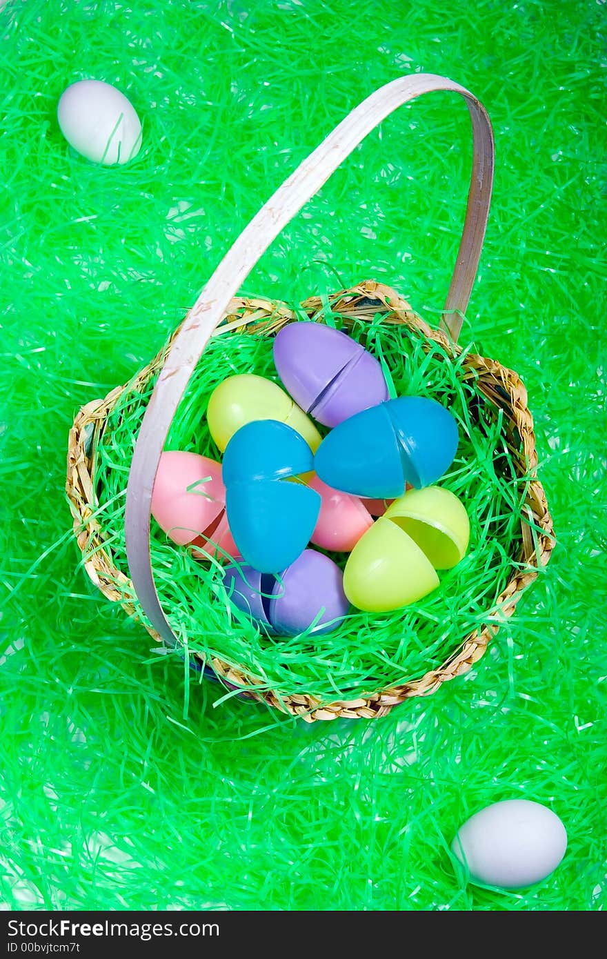 Broken eggs in a basket with two undamaged eggs outside the basket in theme of don't put all your eggs in one basket cliche'