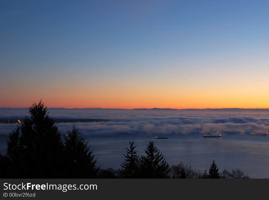 Sunset over foggy ocean, night scene. Sunset over foggy ocean, night scene