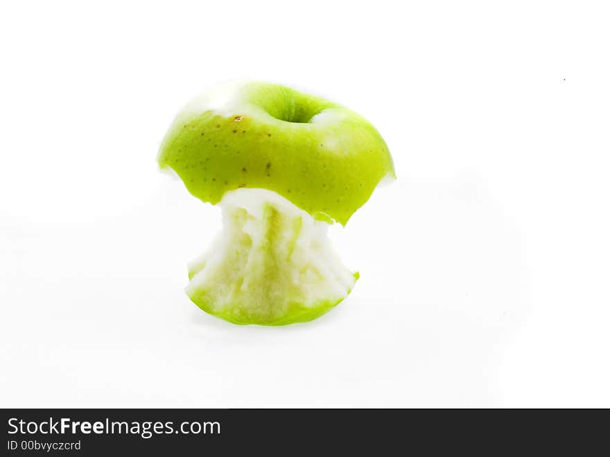 Eating green apple on white background