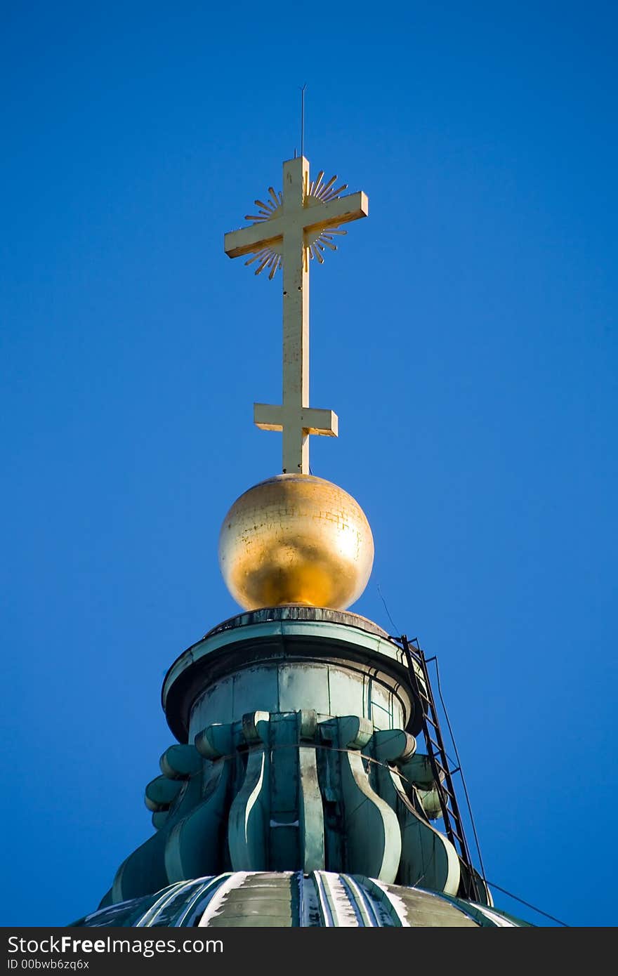 Gold cross at top of the Kazan cathedral in St.-Petersburg. Gold cross at top of the Kazan cathedral in St.-Petersburg