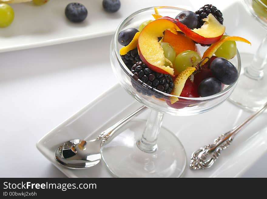 Fruit salad elegantly served in stemware. Horizontal photo format. Fruit salad elegantly served in stemware. Horizontal photo format.