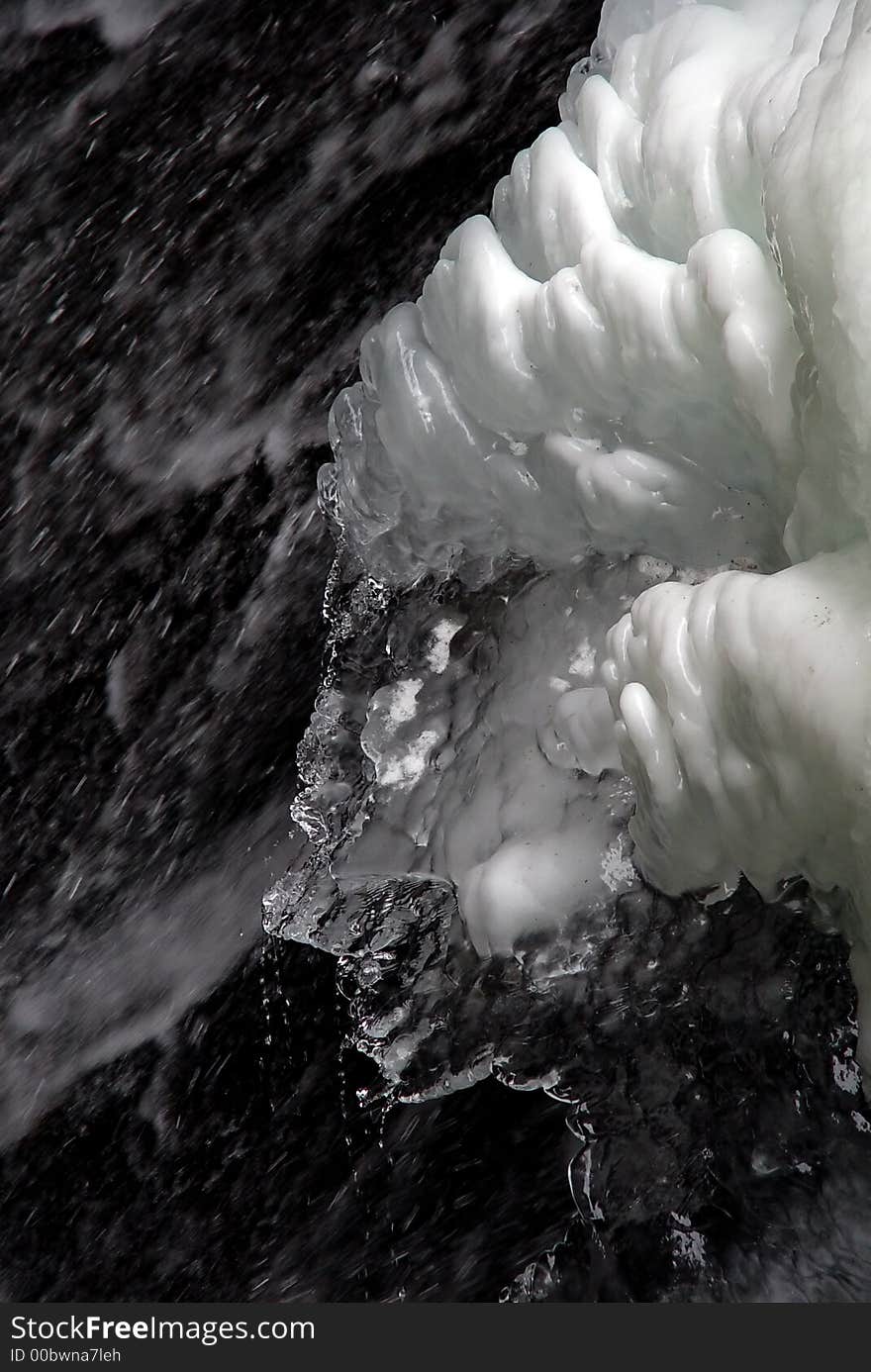 Abstract snow and ice over flowing water