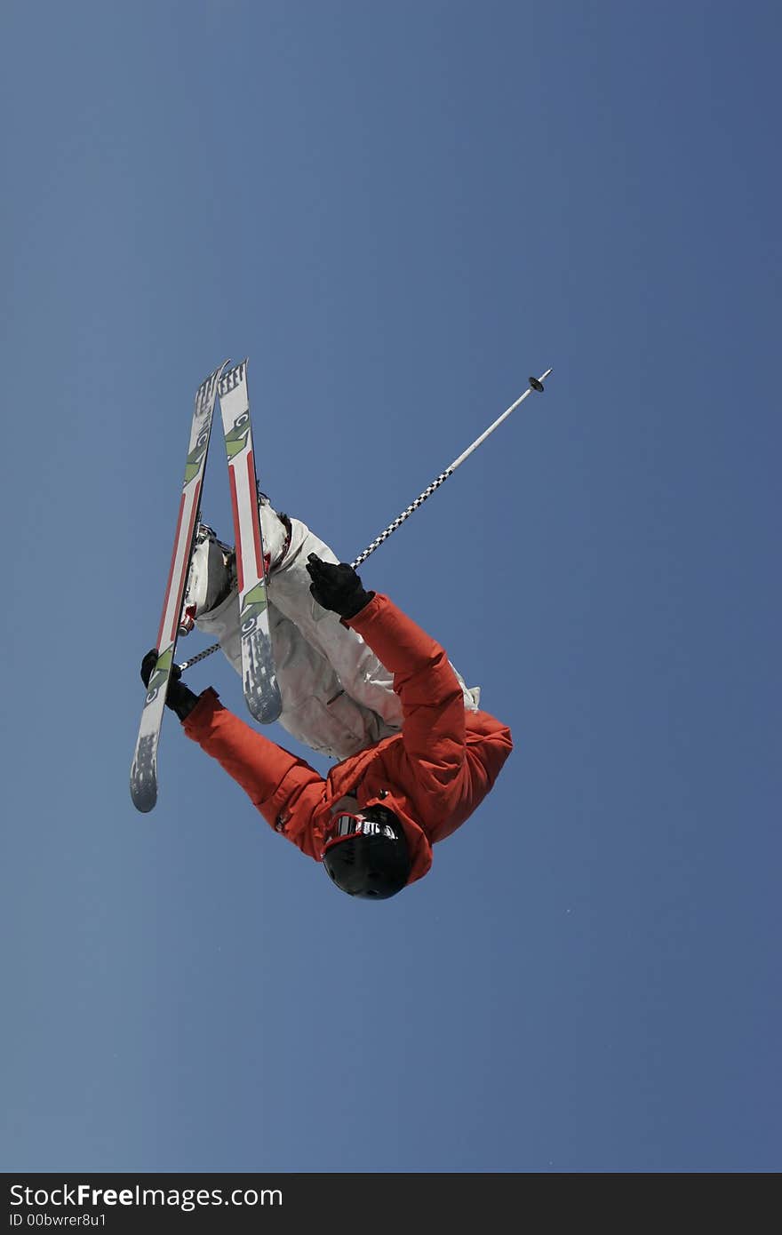 A talented freestyle skier blasts an inverted truck driver air off a jump. A talented freestyle skier blasts an inverted truck driver air off a jump.