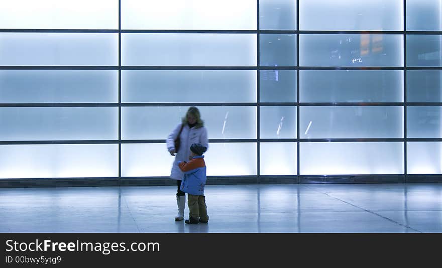 Mother and child in the Potsdamer Platz train station in Berlin