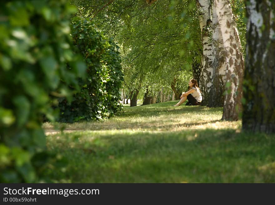 Girl thinking in a forest