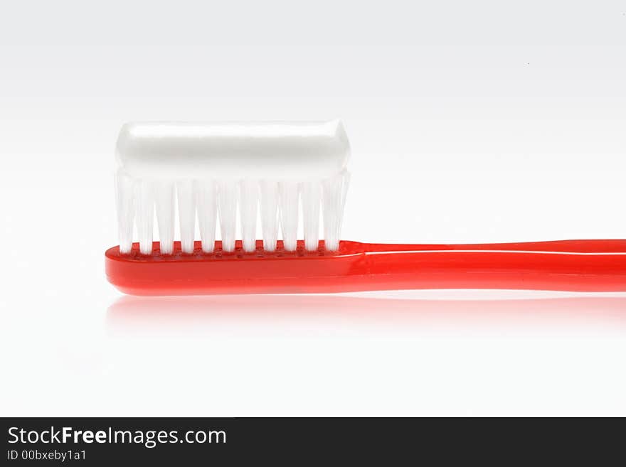 Red Toothbrush With Paste