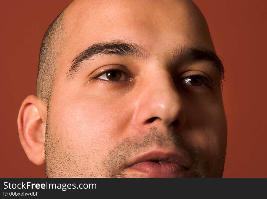 Close up of an young man, shot in studio