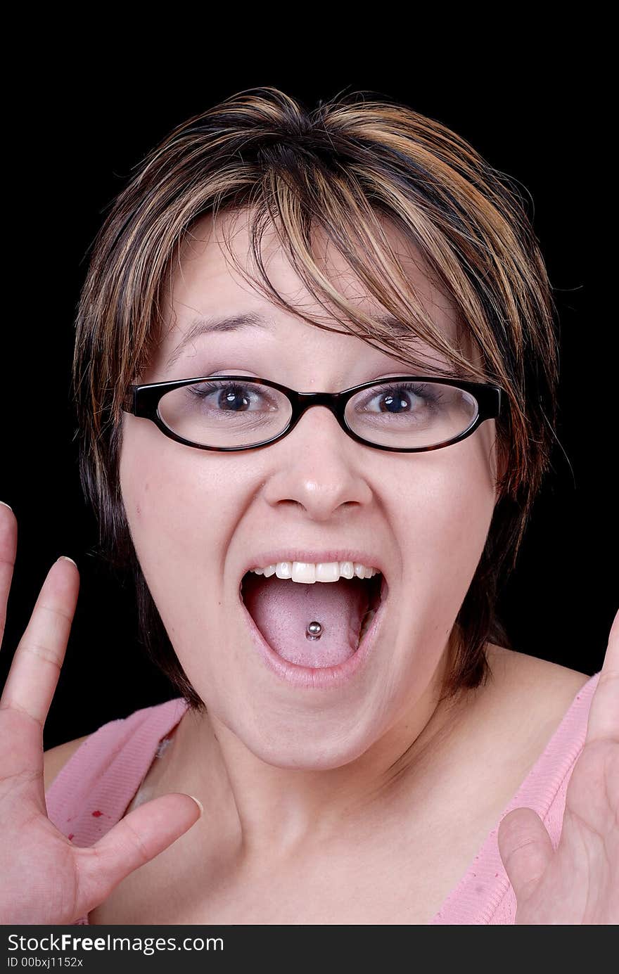 Young woman with highlighted hair and tongue stud. Young woman with highlighted hair and tongue stud