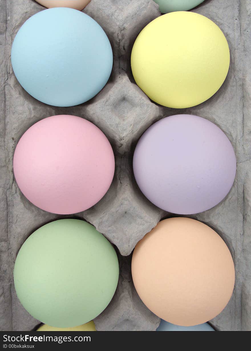Pastel Easter eggs in a carton