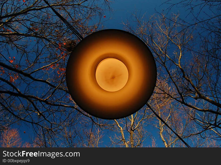 A shot of outdoor lamp during daytime, resembling a ufo. A shot of outdoor lamp during daytime, resembling a ufo.