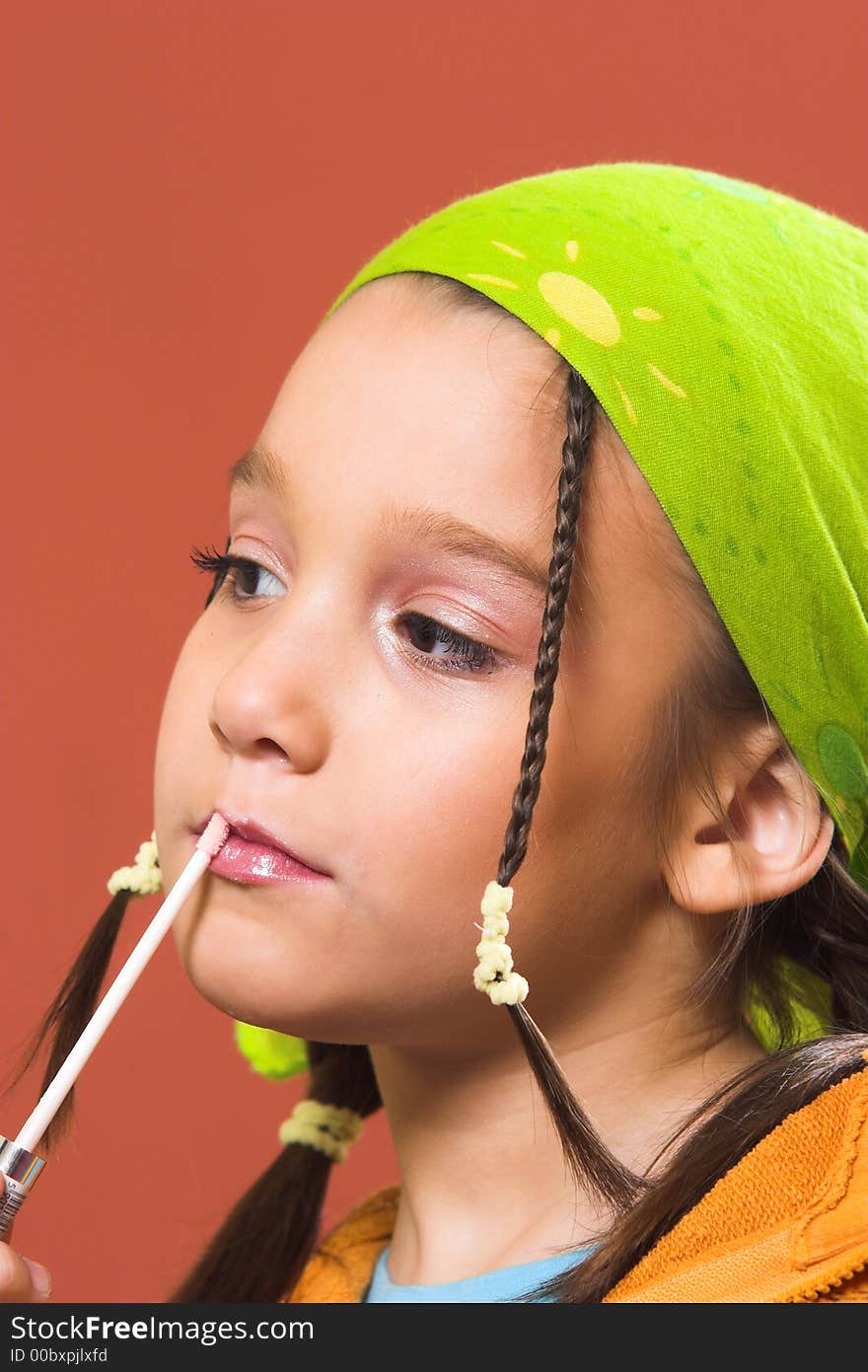 Child applying make-up