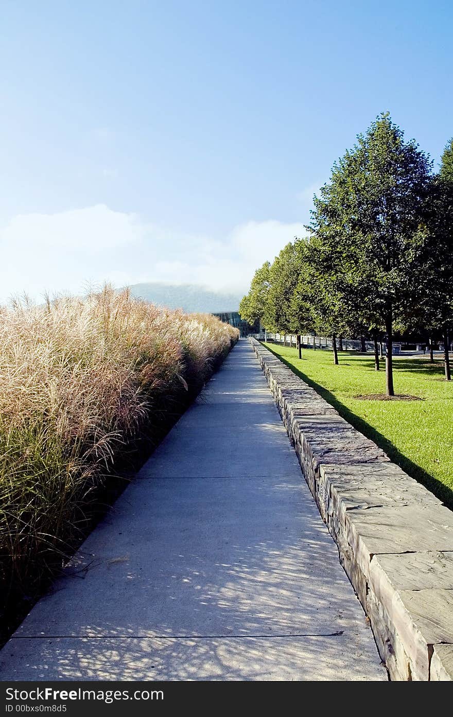 Walkway seems to stretch to the distant horizon and misty mountains. Walkway seems to stretch to the distant horizon and misty mountains