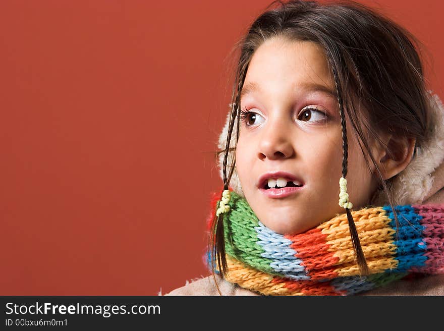 Child with coat and scarf