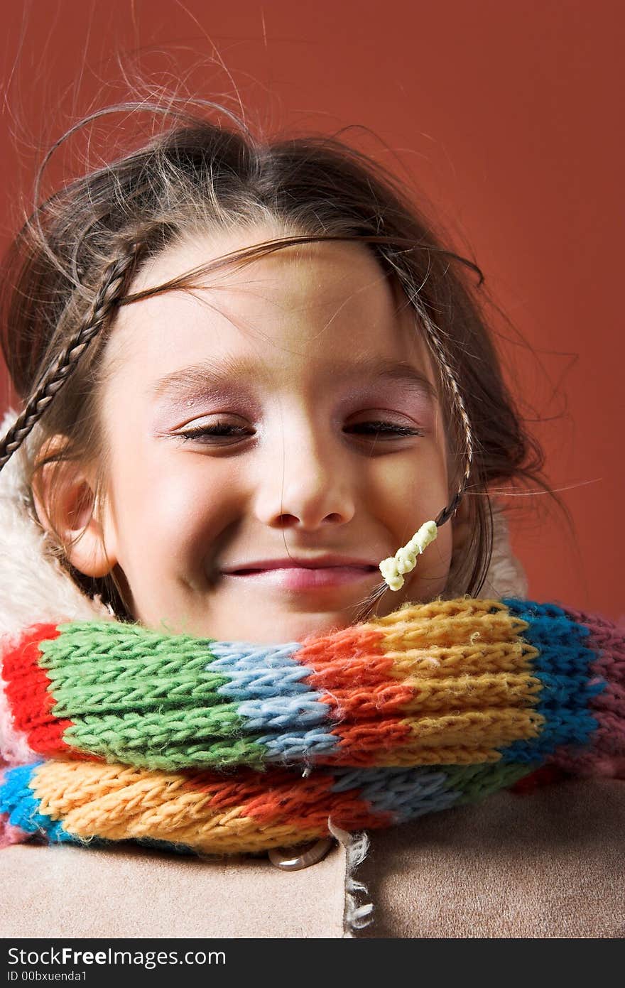 Little pretty child with coat and scarf