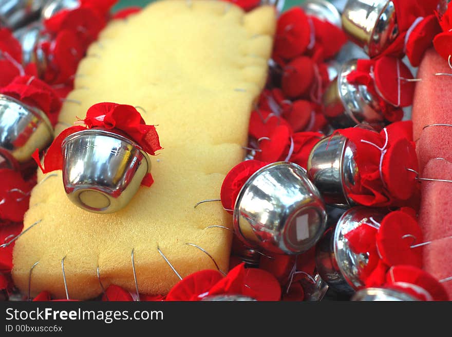 Small milk pots with hooks are hanged and pierced on devotees who fulfills their vows during Thaipusam. Small milk pots with hooks are hanged and pierced on devotees who fulfills their vows during Thaipusam.