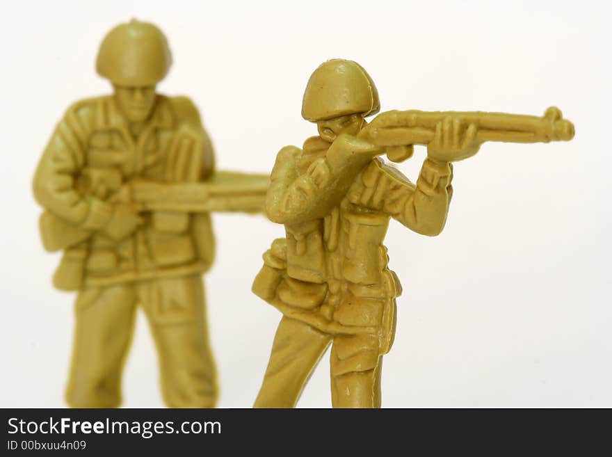 A couple of firing toy soldiers