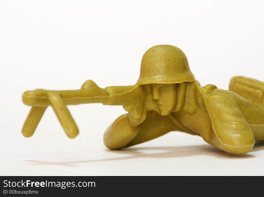 A firing toy soldier figure.