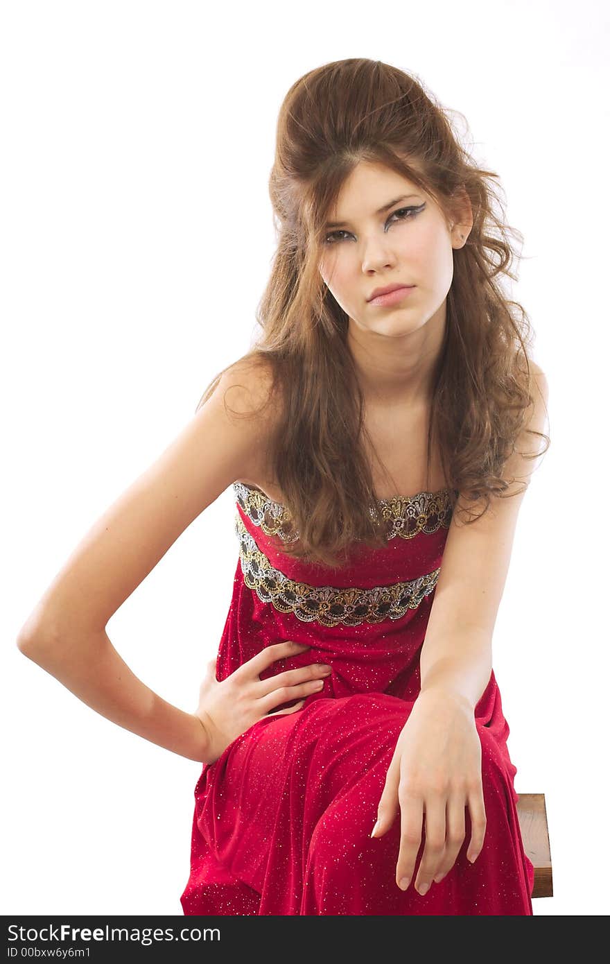 Portrait of girl in red dress. Isolated