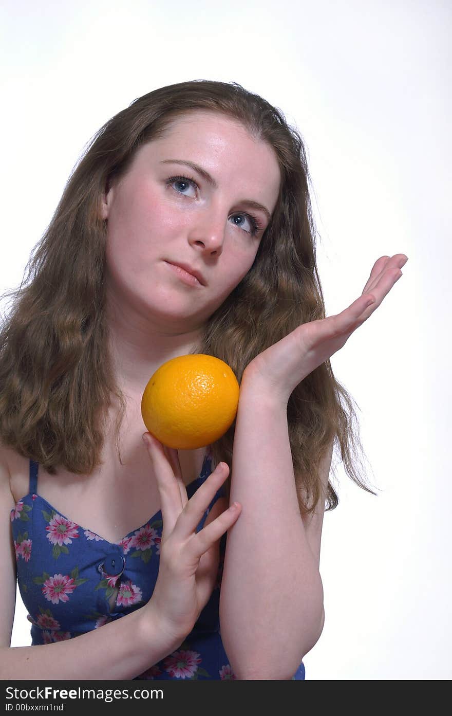 The girl with a orange in her hands