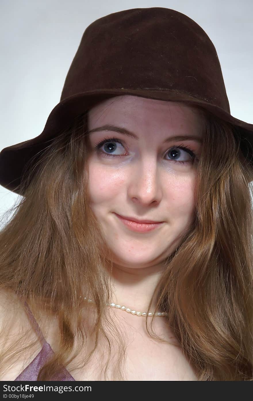 The Girl With  Long Hair In A Retro  Hat