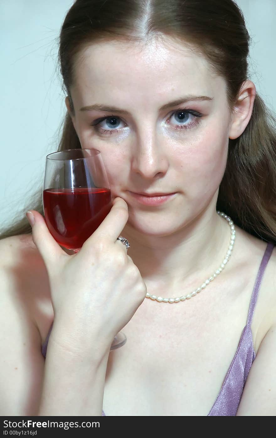 The girl with a glass in the hand