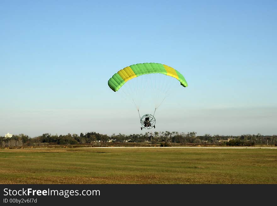 Paraglider taking off over Florida's flat land. Paraglider taking off over Florida's flat land.