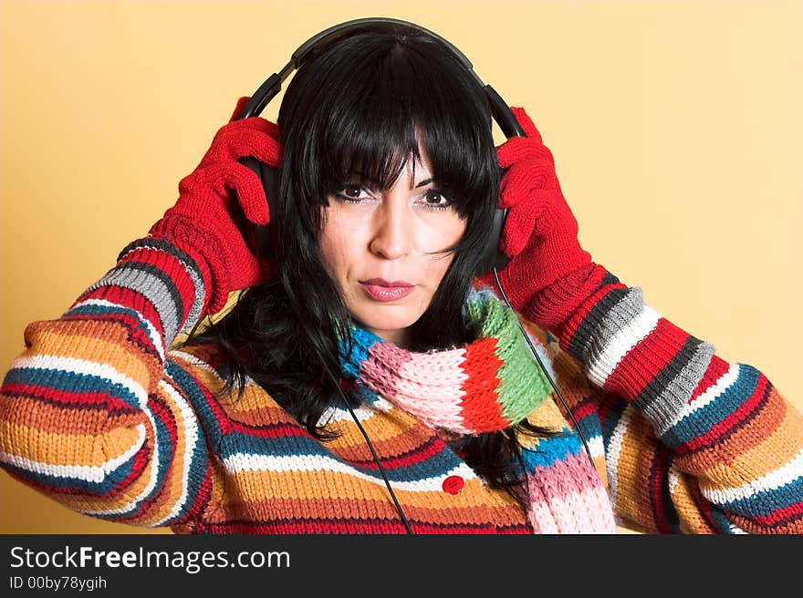 Beautiful woman listening music in headphones