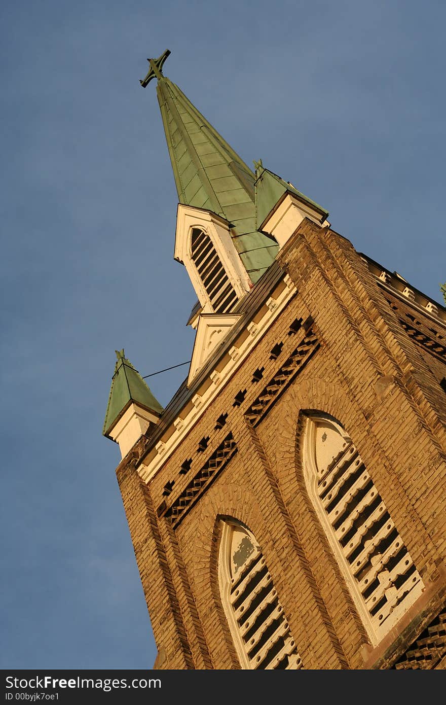 Old church tower against blue sky