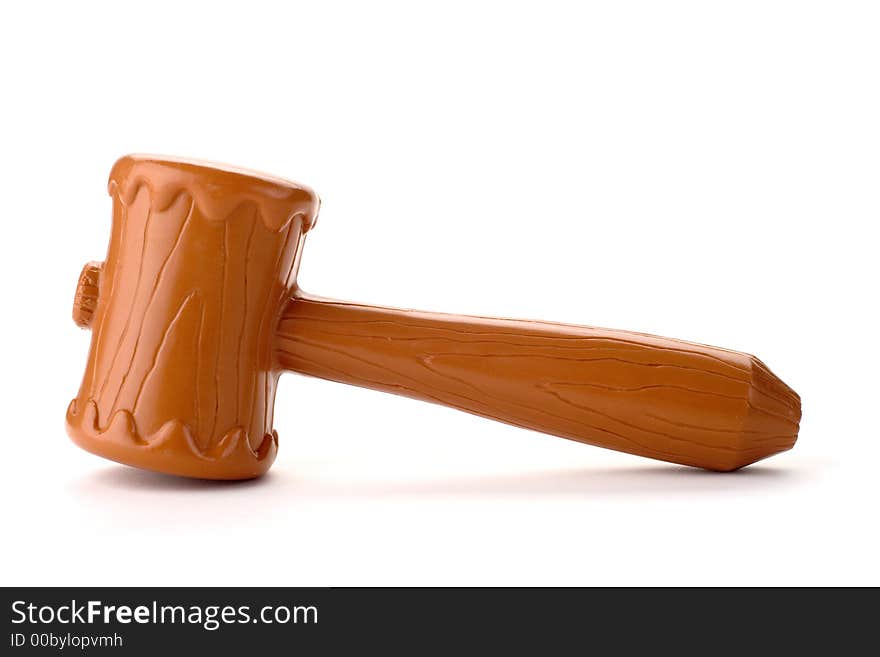 A brown plastic toy gavel