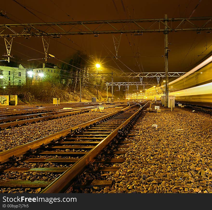 A train passing at night. A train passing at night