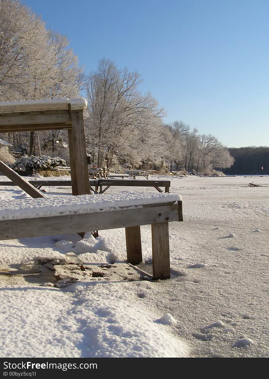 Docks trapped in the ice at a frozen lake