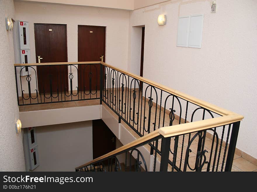 Hotel stair resting place with doors