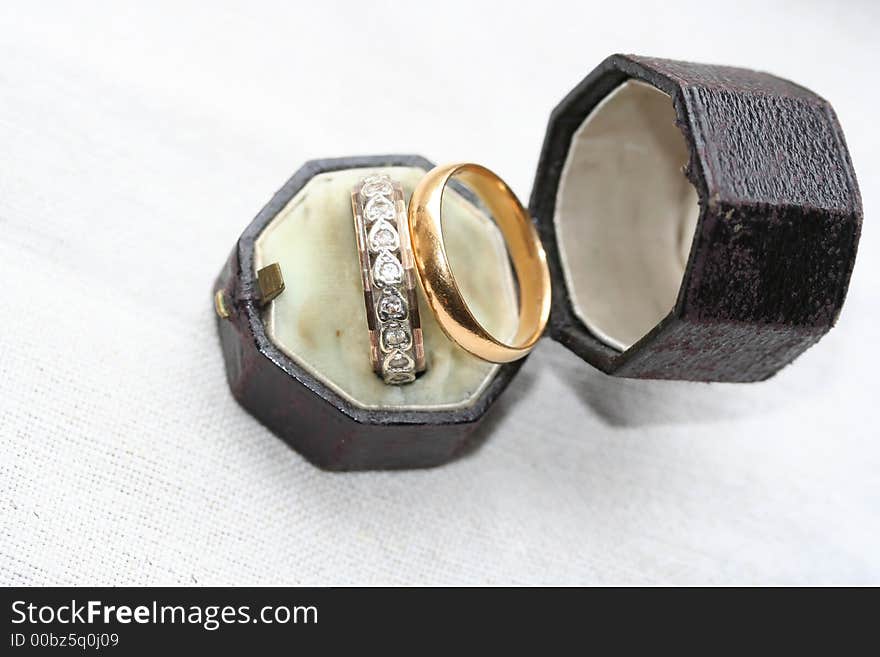 Heart shaped diamonds in ring inside antique leather box