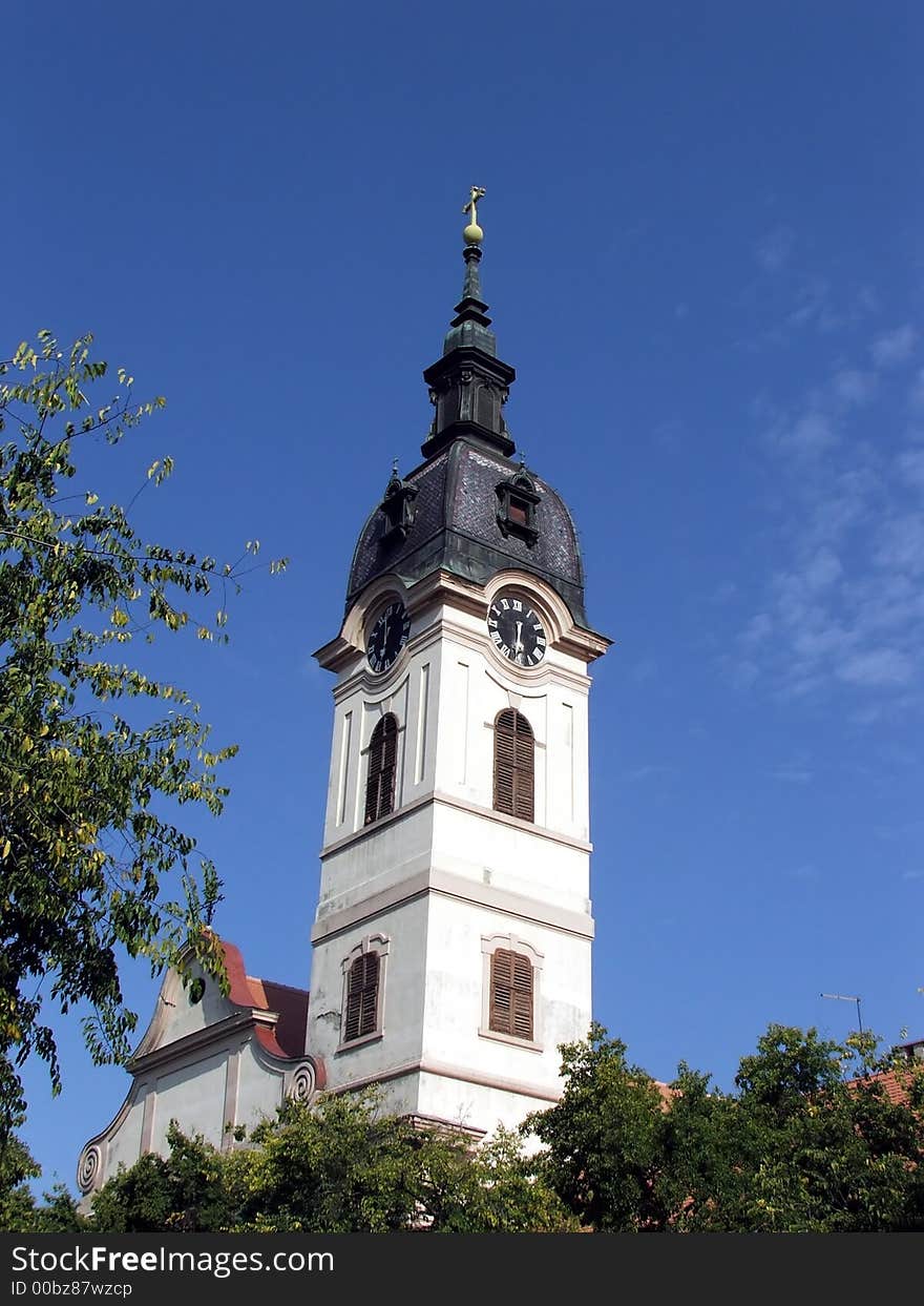 Sombor catholic church tower on the blue sky. Sombor catholic church tower on the blue sky