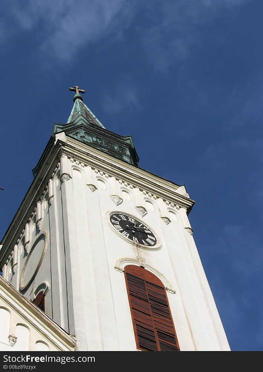 Sombor catholic church tower on the blue sky. Sombor catholic church tower on the blue sky