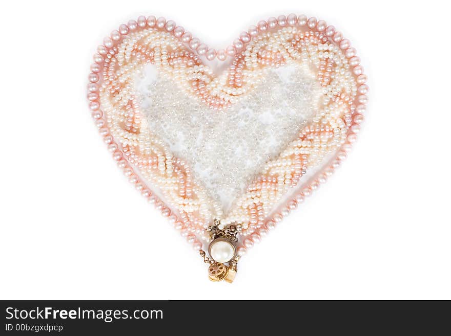 Heart-shaped pearl necklace on white background. Heart-shaped pearl necklace on white background