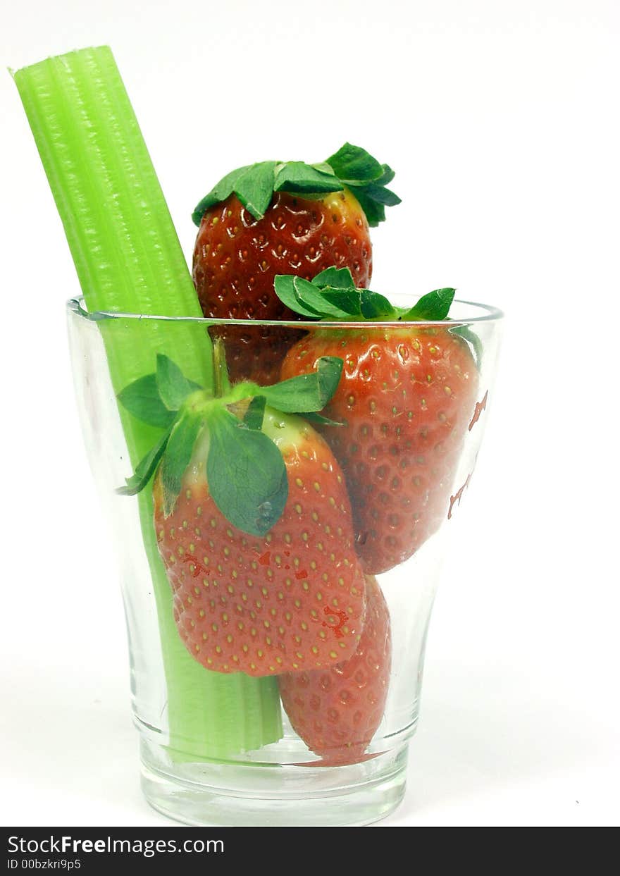 Fresh green cerely stem with red strawberry. Fresh green cerely stem with red strawberry