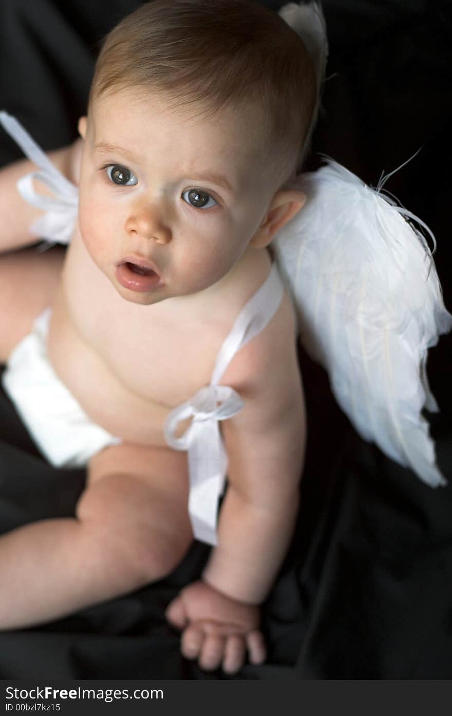 Image of baby wearing angel wings. Image of baby wearing angel wings