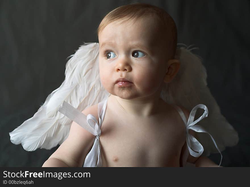 Image of baby wearing angel wings. Image of baby wearing angel wings